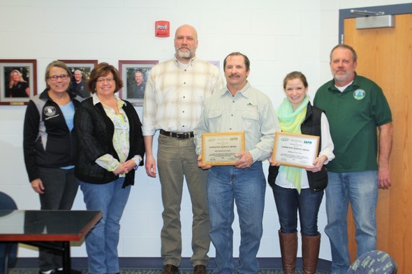 Pictured left to right Lindenhurst Park District Commissioners Lisa Behnke, Christine Hunecke, Todd Solbrig, Millburn Tree Farm's Bob Holbach, Daughter Allison Holbach and Park Commissioner James Stout.